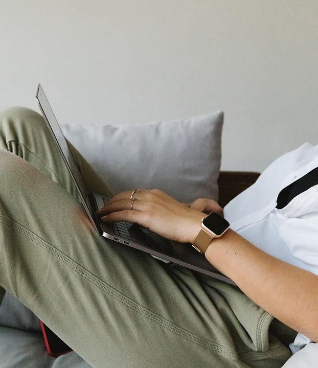 Woman sitting with laptop