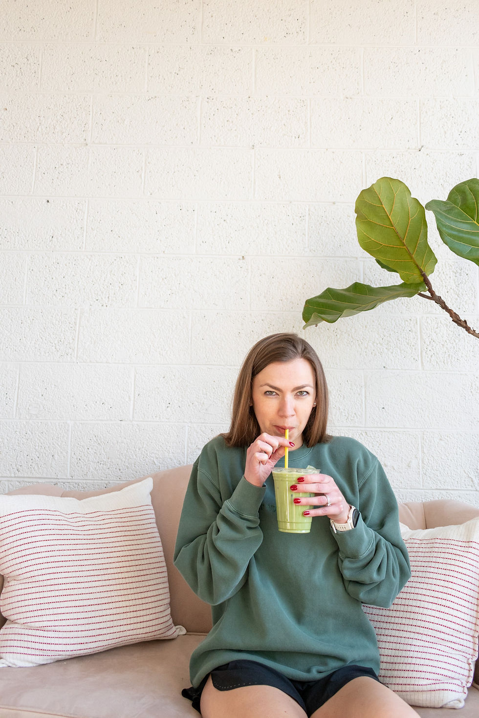 Girl in green sweatshirt that says “eat your greens” 