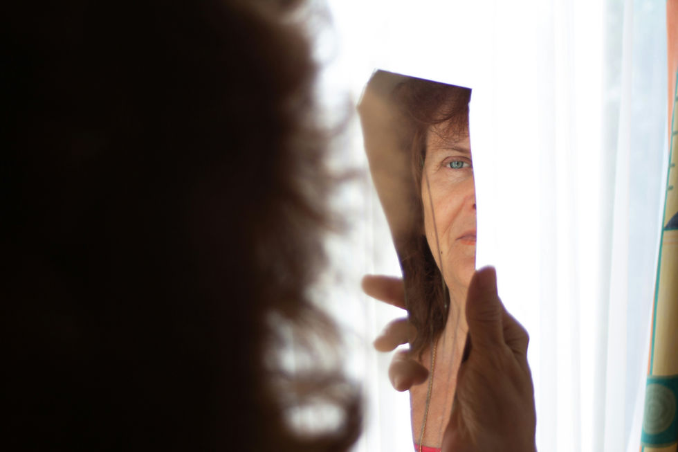 Person alone in quiet reflection, struggling with feelings of not being good enough