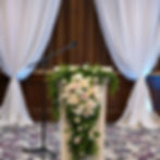 A speech podium decorated for a wedding.jpg