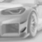 Side angle of BMW M2 G87 with mounted front bumper canards