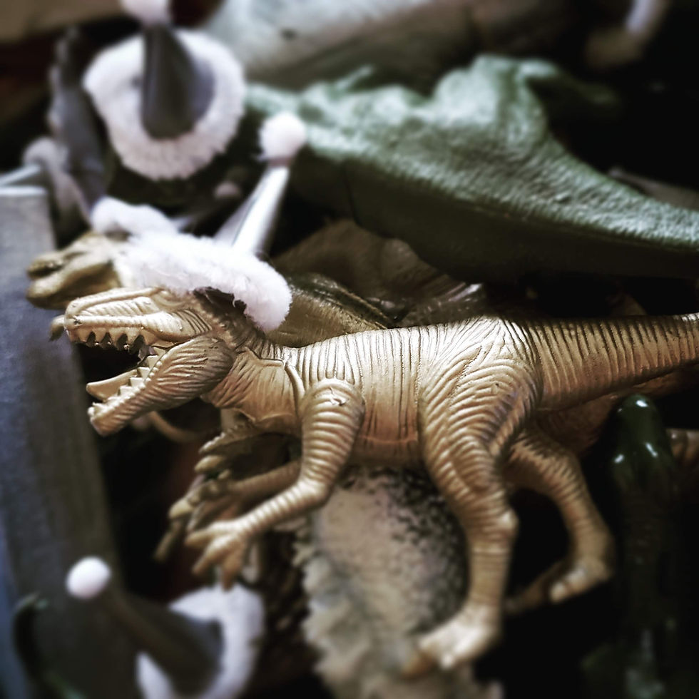 toy dinosaur wearing a party hat