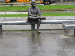 bronze sculpture of a weary...
