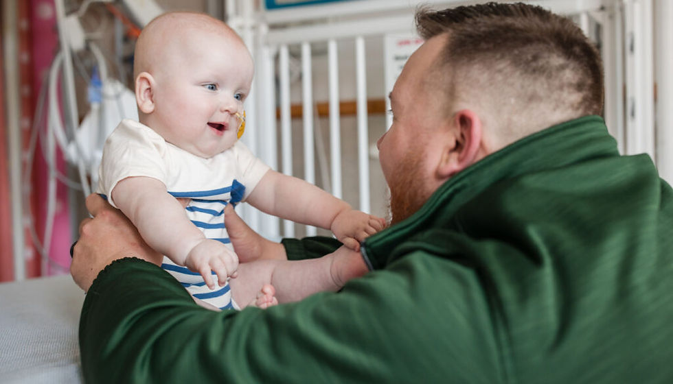KJ Muldoon, the young patient who received the new CRISPR-Cas9 treatment, with his father. Courtesy of the Children's Hospital of Philadelphia