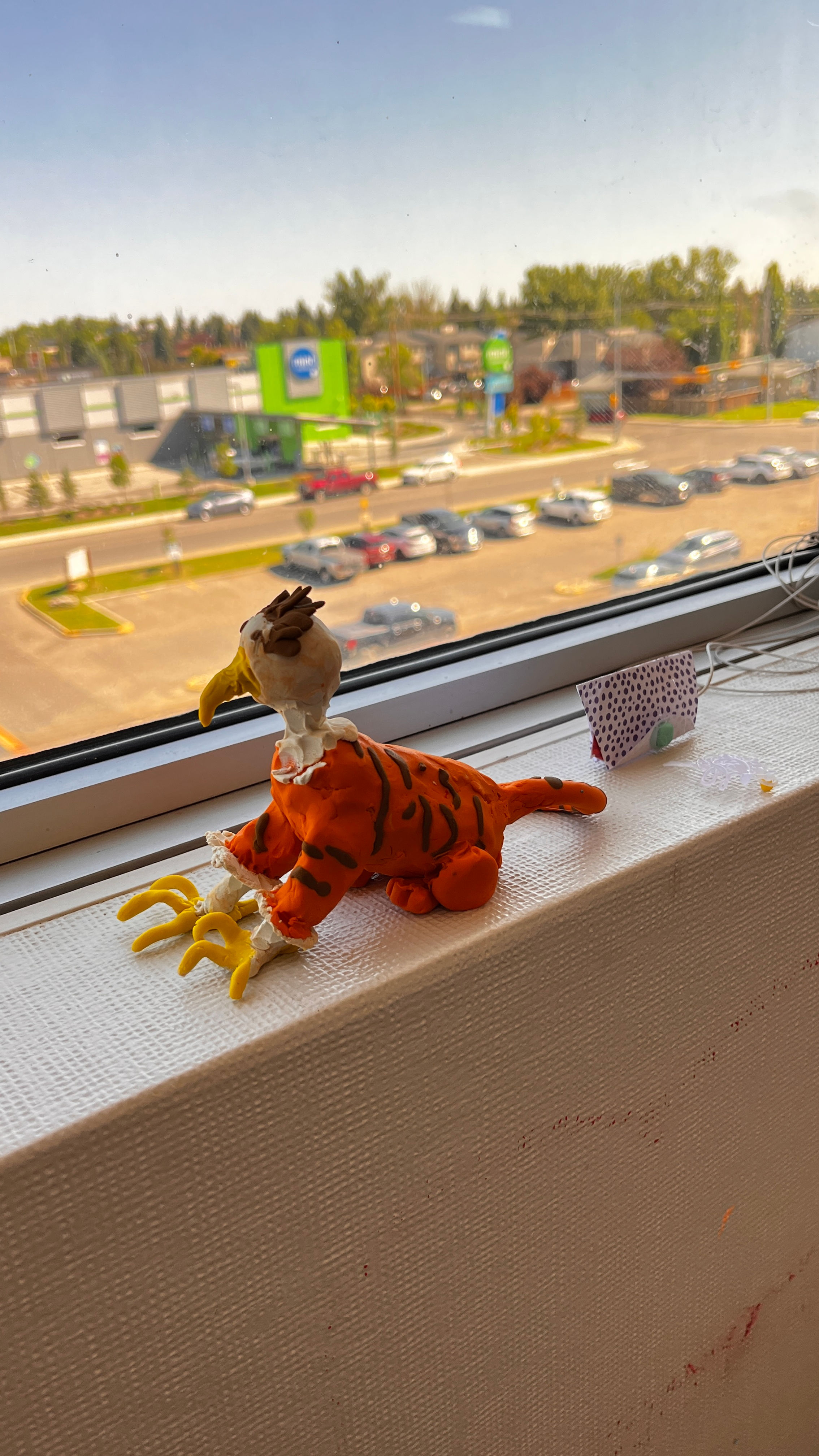 Fantasy animal. Mix of a tiger and an eagle. Clay sculpture