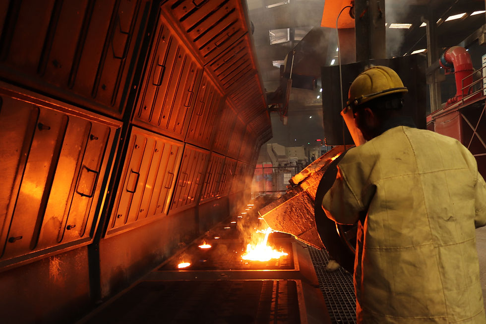 A worker operating on metals.