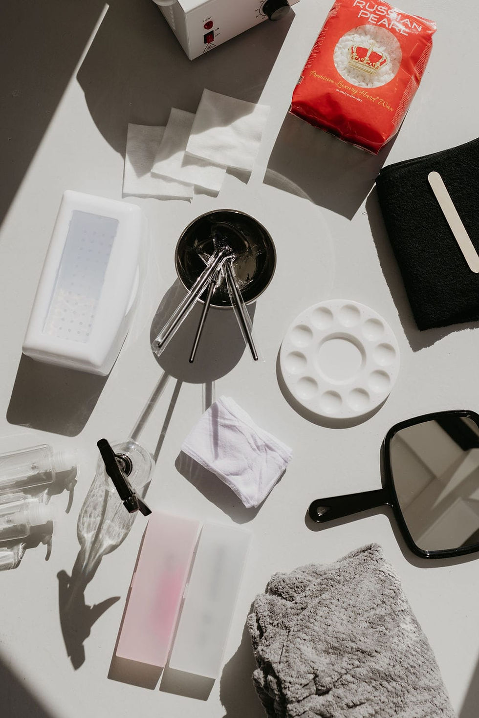 Set of professional esthetician tools on treatment tray