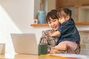 Mother holding toddler