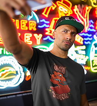 t-shirt-mockup-of-a-black-man-taking-a-selfie-against-neon-signs-a18307.png
