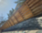 Wooden privacy fence and retaining wall by R&M Landscaping