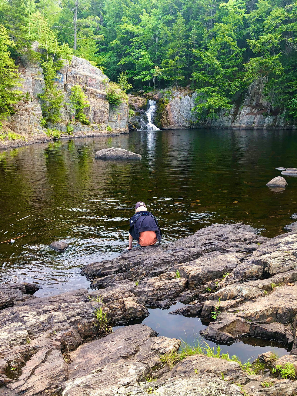 Mikhail plays in the water at Crystal Falls near Greenwood, Nova Scotia.