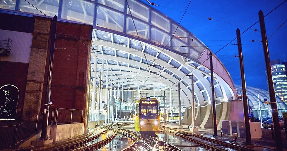 Tram arriving at Victoria Station Manchester at night