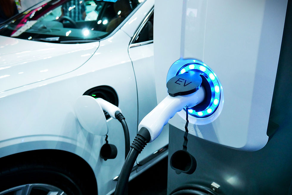 Electric vehicle charging at a station
