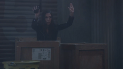 Anna raising her hands in surrender as a decoy at the docks