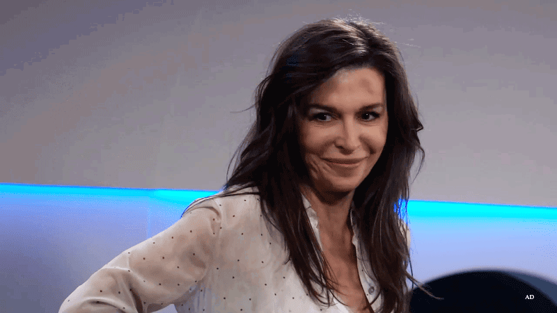 Anna wrinkling her nose at people on the WSB airplane after rescuing Lucky