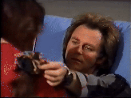 Robert touching Anna's face as he says I love you while recovering from an injury 1991