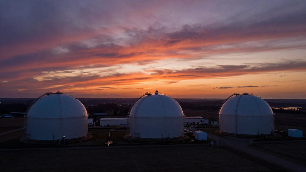 European gas storage tanks at twilight, aerial view of LNG facility entering winter 2026