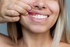 gum-inflammation-closeup-young-woman-showing-bleeding-gums-gray-background-dentistry.jpg