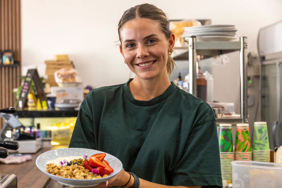 Fresh yoghurt and granola bowl topped with seasonal fruit at Lord Street Social café in Highgate, Perth.