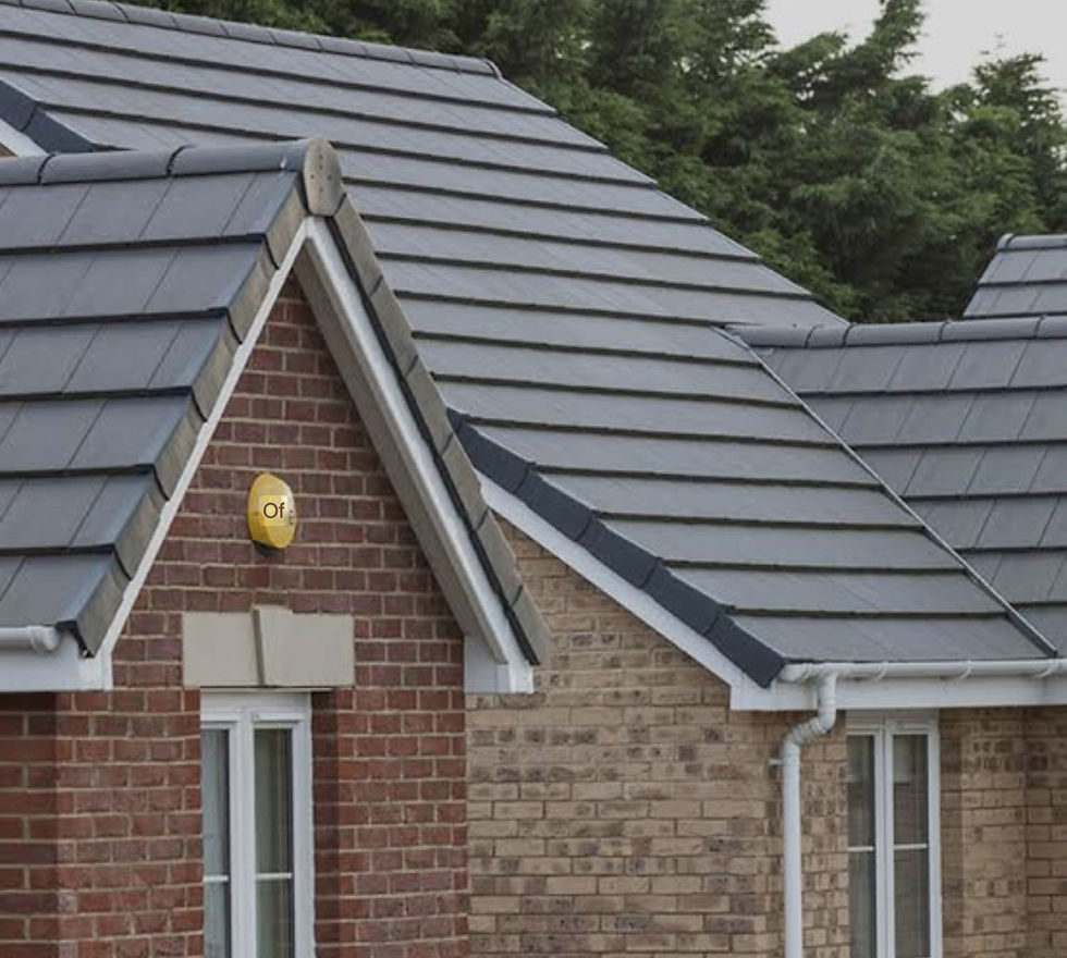 Brick house with gray-tiled roof, surrounded by trees. A yellow alarm box with "Of" text is mounted above a window. Overcast mood.