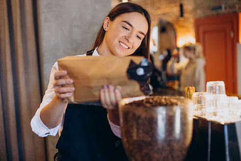 woman-grinding-coffee-coffee-machine.jpg