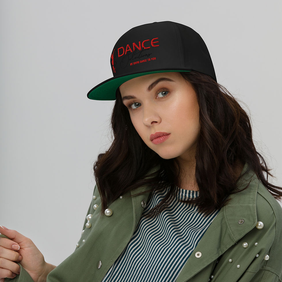 Woman in black flat bill cap with red 'DANCE' text