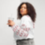 Thumbnail: Woman wearing white cropped windbreaker with patterned sleeves