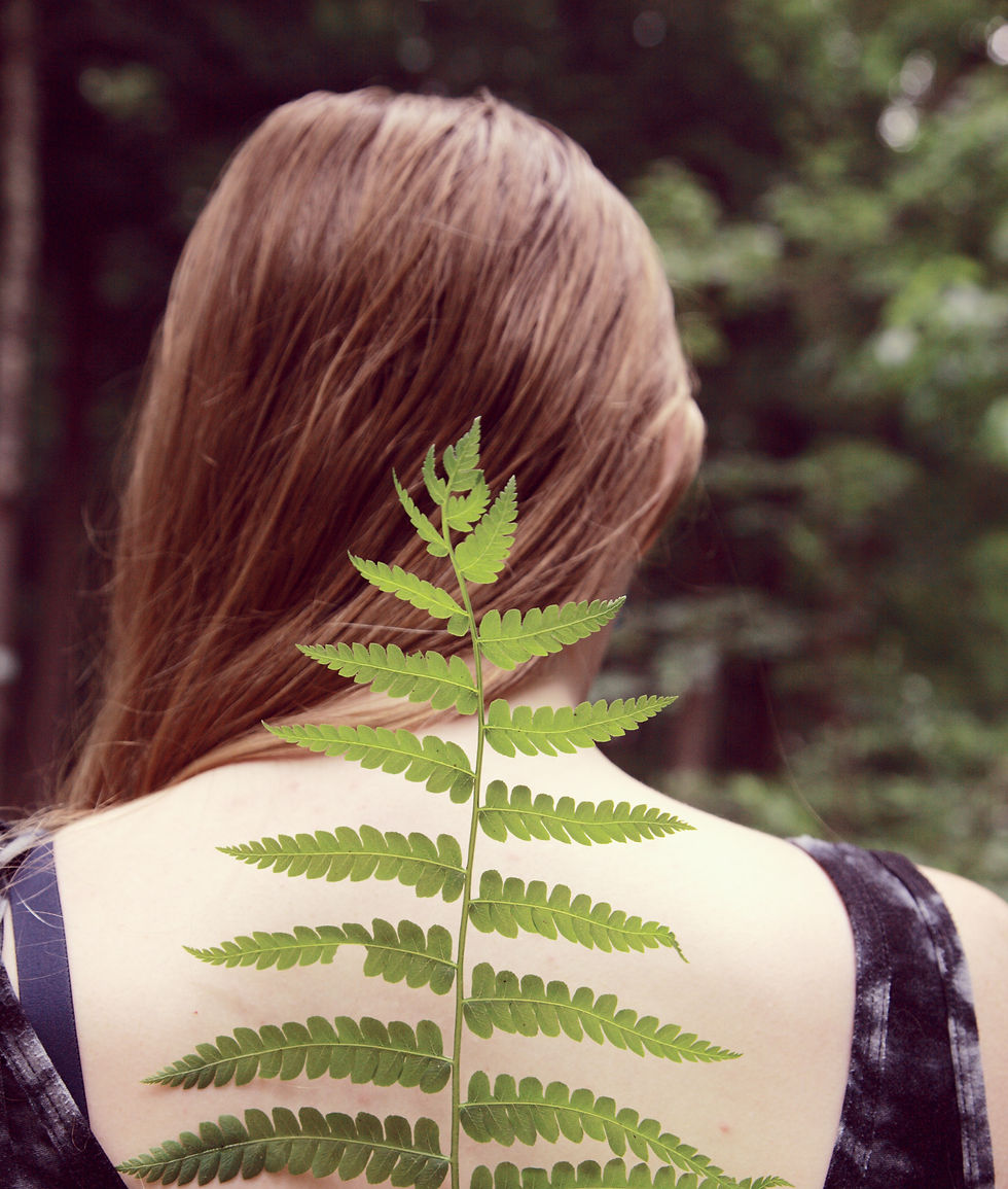 Woman with leaf over spine