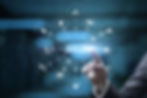 Finger pointing at virtual "Skills" button, surrounded by icons like gear, lightbulb, in a digital blue-toned interface background.