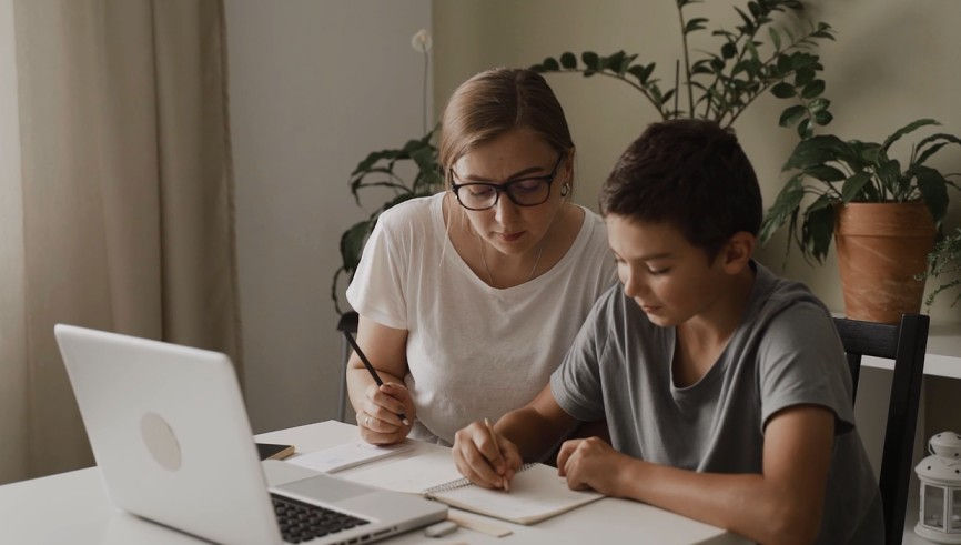 Child learning from teacher