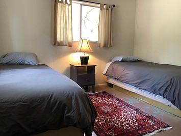 Twin beds in Beech - Cabin 5 at Pine Grove in Cobb, California
