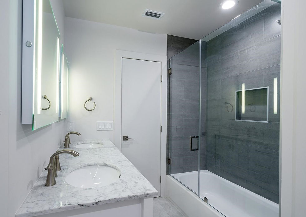 Sleek bathroom finishes with contemporary design in Palmetto Bay home renovation project