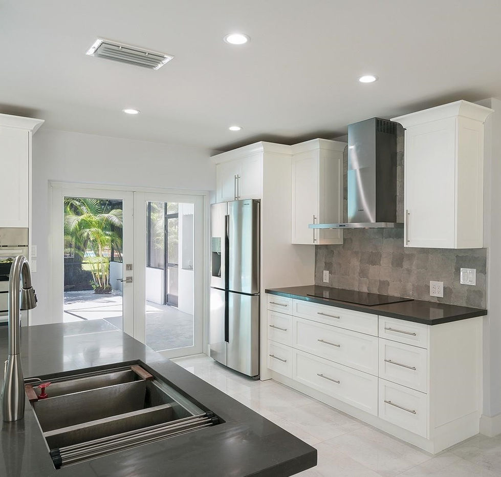 Open-concept modern kitchen with sleek cabinetry and natural light from impact windows in Palmetto Bay, Miami
