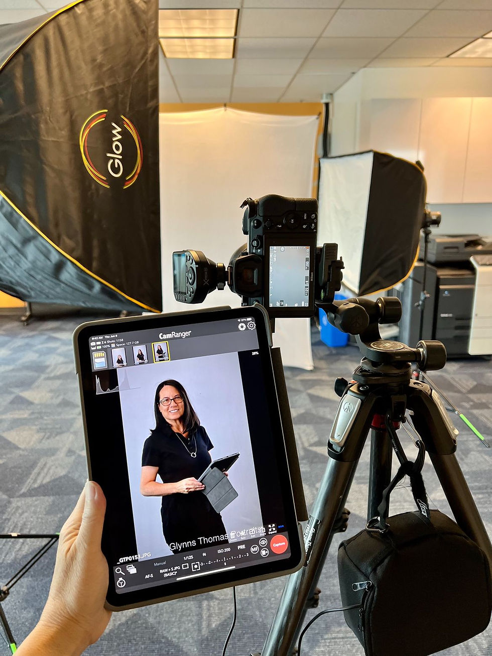 Corporate headshot photography in Oakland of engineering consultant employees photographer setup in conference room with grey carpet