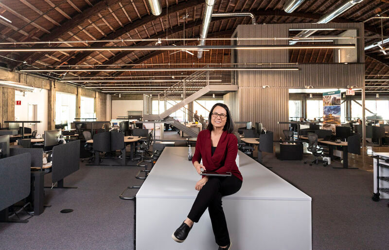 Female photographers near me in Sacramento at an architect firm photographing professional headshots