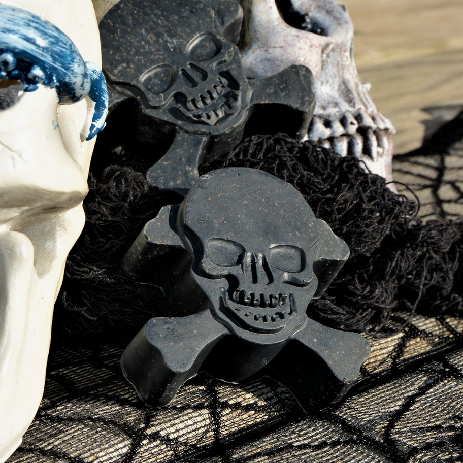 Close-up of skull-shaped soap on black netting, Halloween decoration