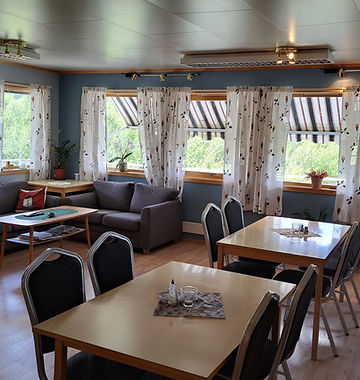 Inside Austertanakrystallen Guest House, warm living room inside the accommodation