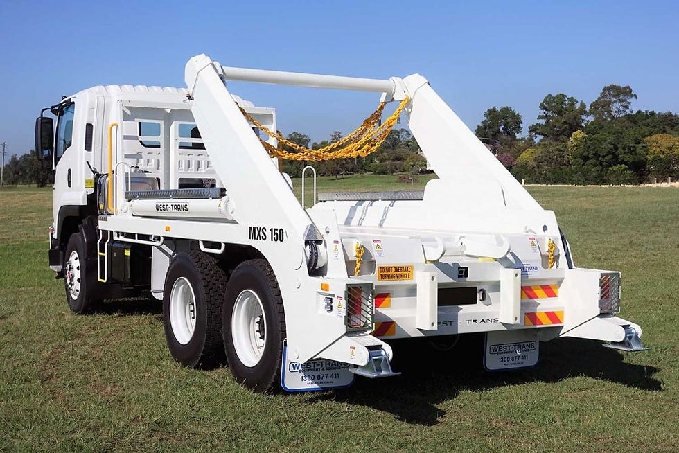 White skip bin truck on grass field