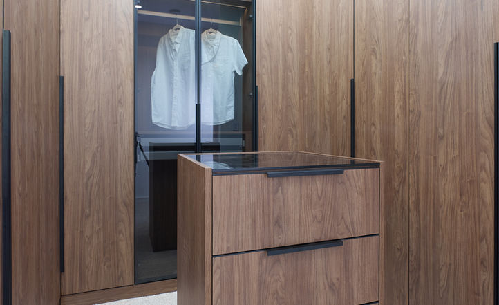 Custom walk-in wardrobe with walnut cabinetry and central island Sydney — Kitchemble