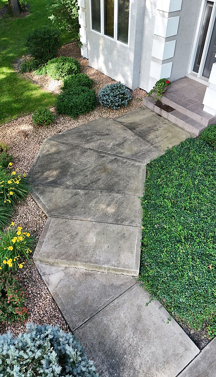 Dirty concrete driveway in North Oaks before professional cleaning by DreamClean Exteriors