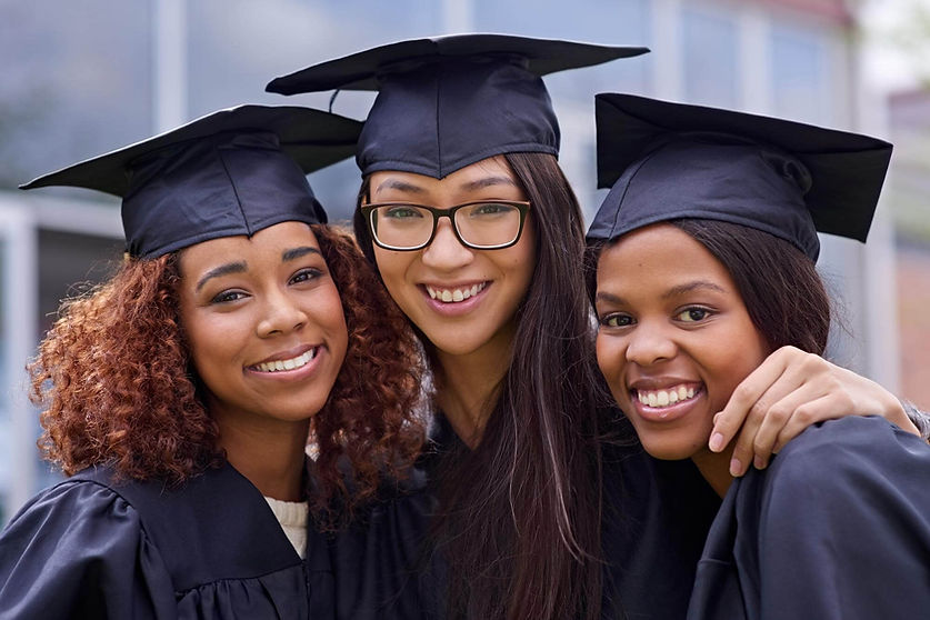 we-did-it-together-cropped-shot-three-young-woman-their-graduation-day-1.jpg
