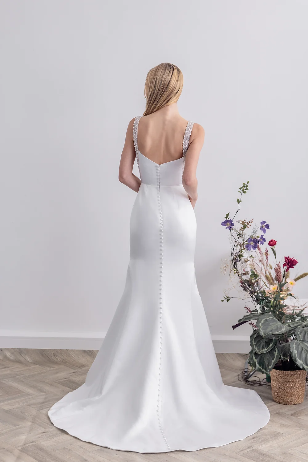 Elegant, simple bridal dress with detailed straps 
