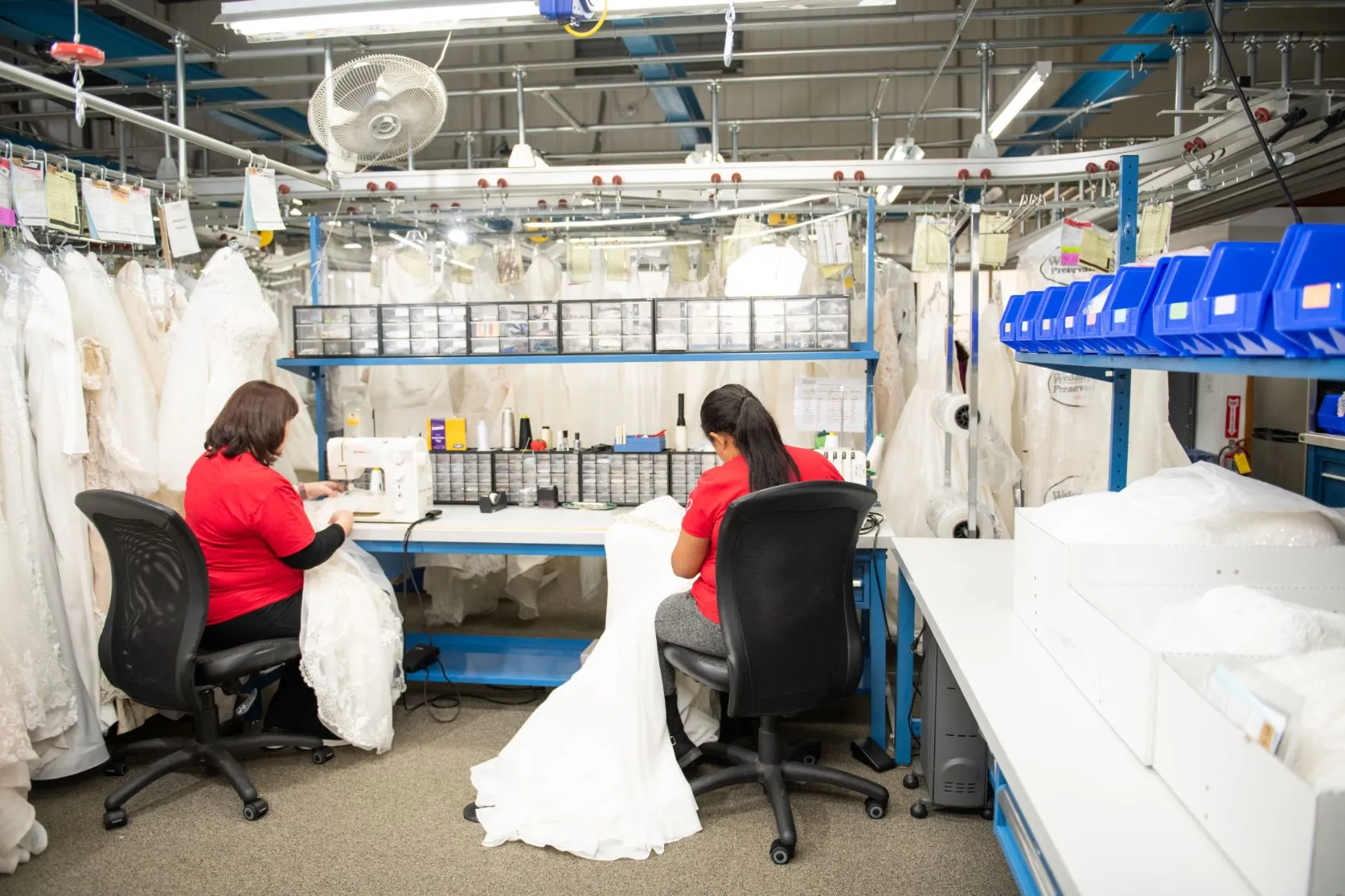 sewing and repairing wedding dresses to prep them for preservation