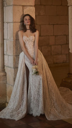 Sottero & Midgley couture wedding gown with all over lace, beaded details, a removable overskirt, and optional long sleeve, available at Senoia Bridal