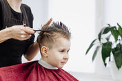 close-up-of-woman-hands-grooming-kid-boy-hair-in-b-2022-02-18-15-22-38-utc.jpeg