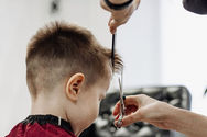 close-up-of-woman-hands-grooming-kid-boy-hair-in-b-2022-02-18-15-27-03-utc.jpeg