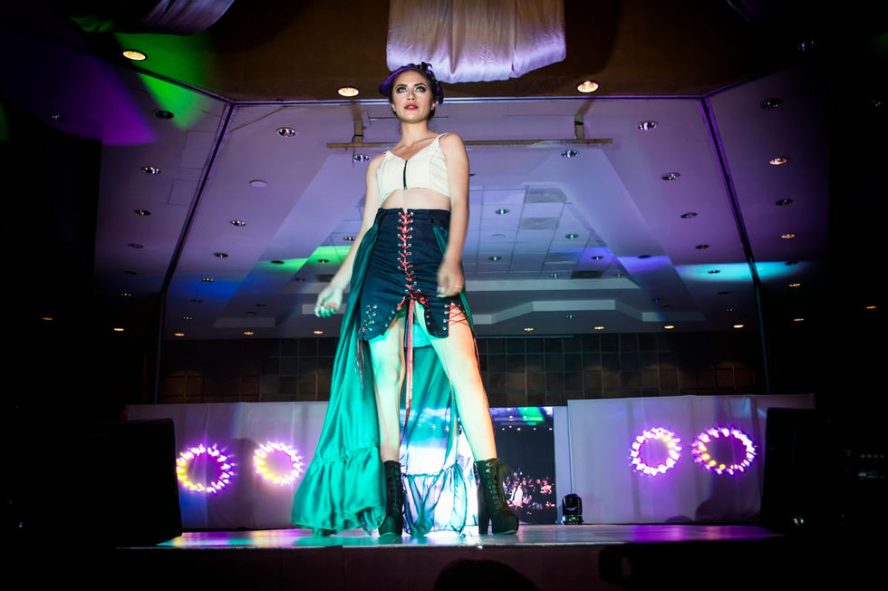 Model showcasing teal high-low skirt, Fashion Photoshoot