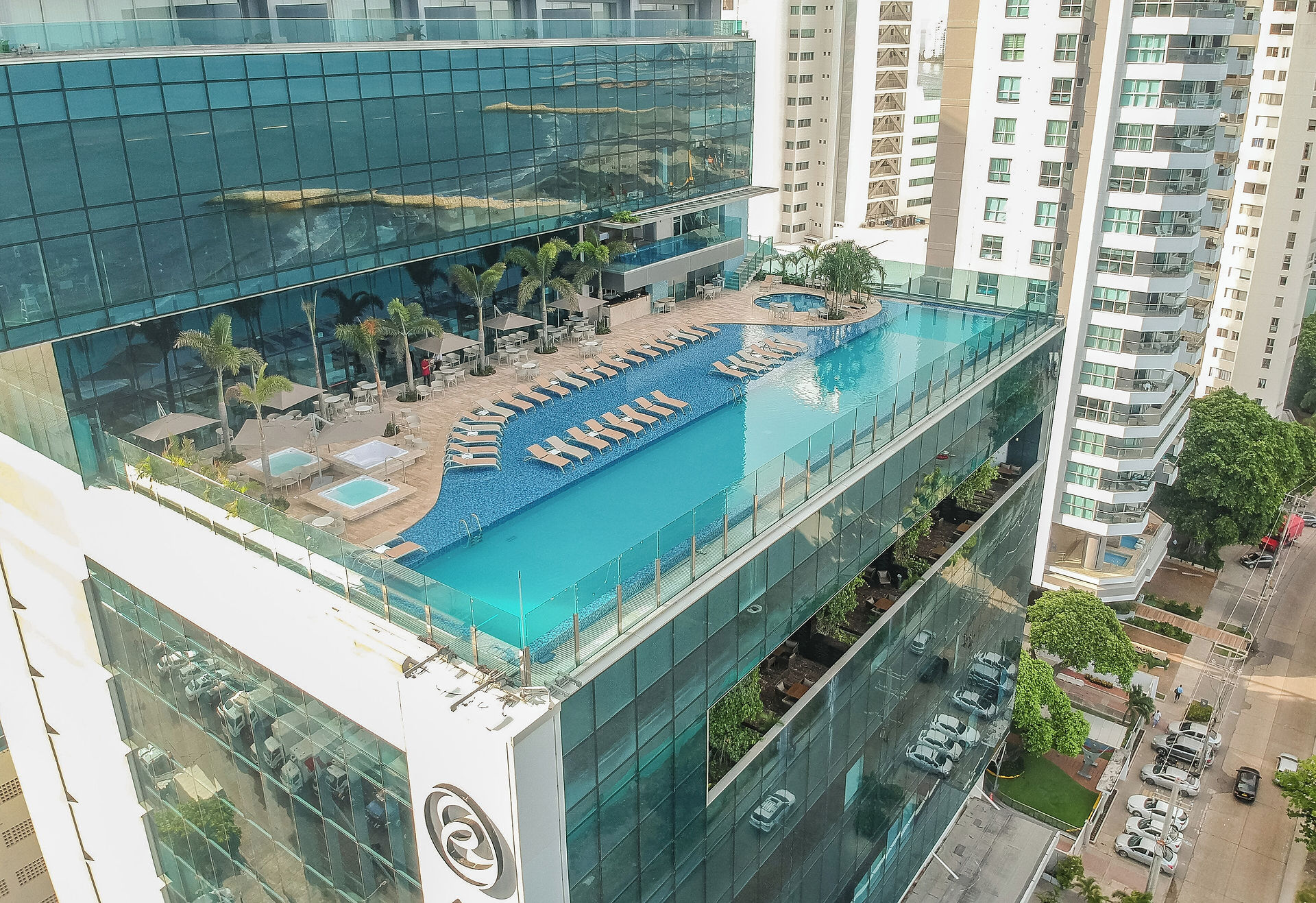 Rooftop pool at Estelar Cartagena de Indias Hotel overlooking a beautiful sunset over the Caribbean Sea in Cartagena