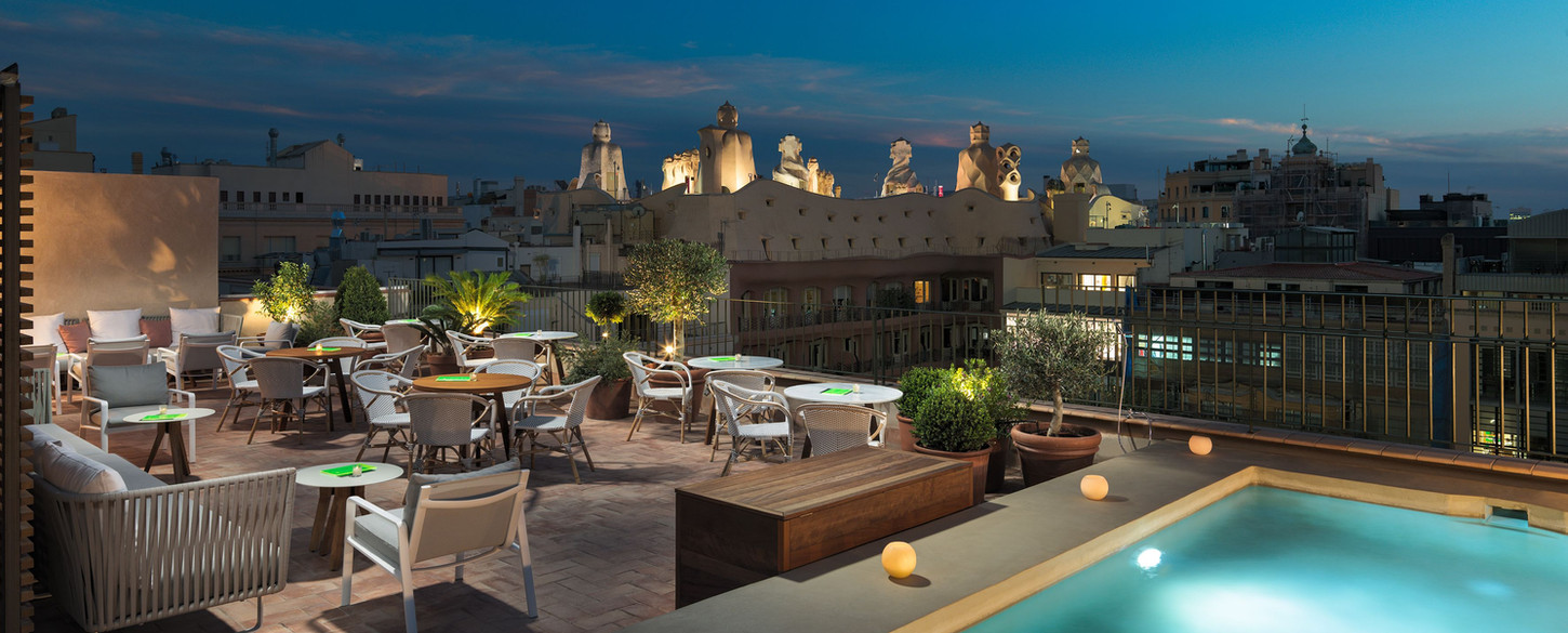 Elegant hotel in Barcelona's Eixample with rooftop terrace and historic architecture