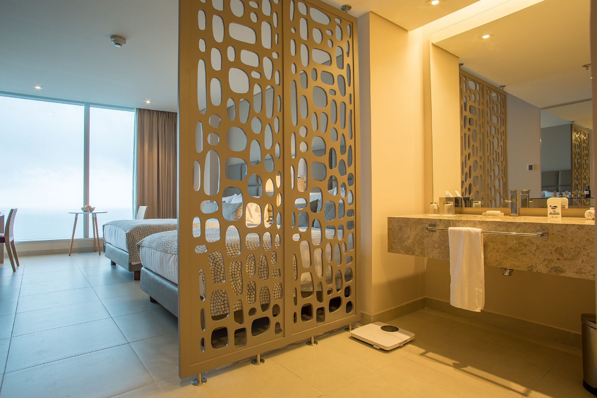 Luxury Superior Room with ocean view at Estelar Cartagena de Indias Hotel featuring premium bedding and modern amenities